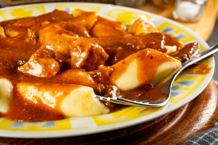 Pork stew in gravy, served with potato dumplings.