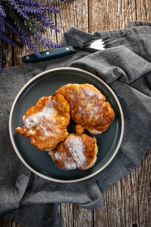 Sweet pancakes made of apple, milk and flour (pancakes)