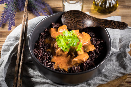 Thai red curry with chicken and black rice. Selective focus.の写真素材