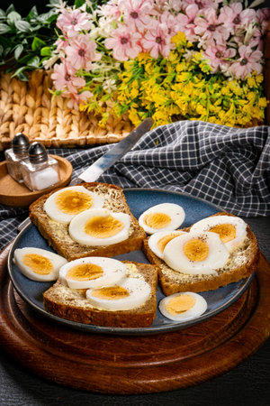 A hearty whole wheat sandwich with boiled eggs.