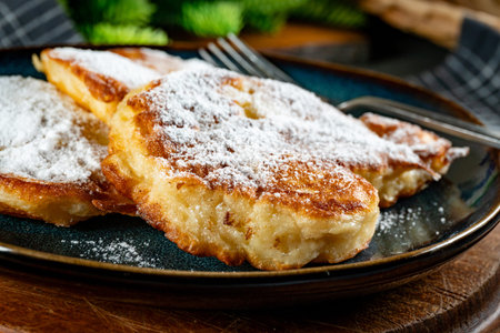 Sweet pancakes made of apple, milk and flour (pancakes).