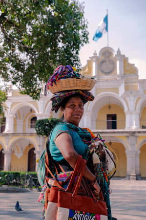Traditional Mayan woman in colorful dress at Antigua Guatemalaの写真素材