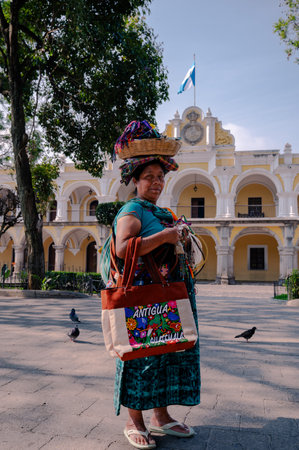 Traditional Mayan woman in colorful dress at Antigua Guatemalaの写真素材