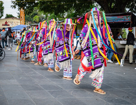 Vibrant costumes and masks in Danza de los Viejitos performance in Mexicoの写真素材