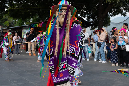 Vibrant costumes and masks in Danza de los Viejitos performance in Mexicoの写真素材