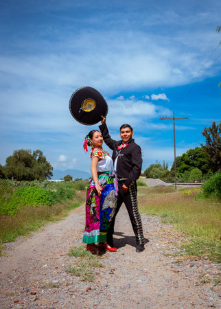 Traditional Mexican charro and folkloric dancer in colorful outfits celebrating cultureの写真素材