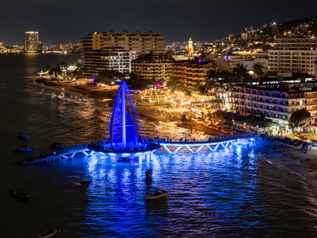Night aerial view of Los Muertos Pier with fireworks in Puerto Vallartaの写真素材