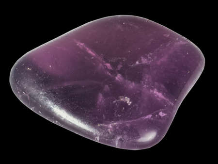 amethyst pebble with transparent cracked structure macro isolated on black