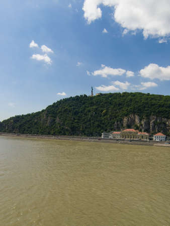 Gellert hill in Budapest, Hungary, view from river Denube in summer day with small clouds, selective focus.の写真素材