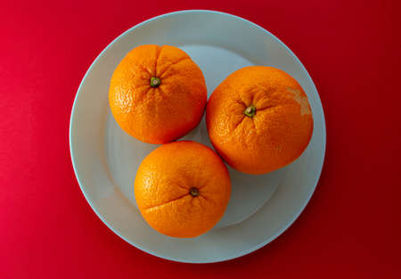 still life with natural and fresh seasonal fruits on a green plate