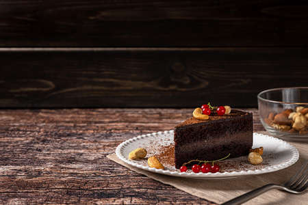 Raw vegan chocolate cashew cake on dark vintage backgroundの写真素材