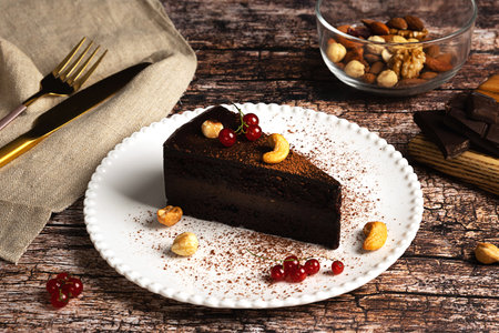 Raw vegan chocolate cake on dark vintage backgroundの写真素材