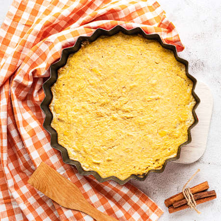 Top view of a homemade pumpkin pie on grey backgroundの写真素材