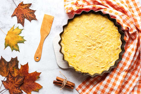 Top view of a homemade pumpkin pie on grey backgroundの写真素材