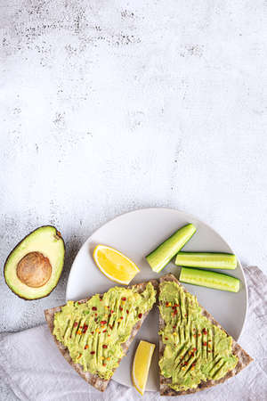 Crisp bread sandwiches with mashed avocado and cucumberの写真素材