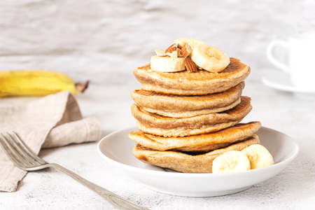 Wholegrain pancakes with banana. Delicious breakfast.の写真素材