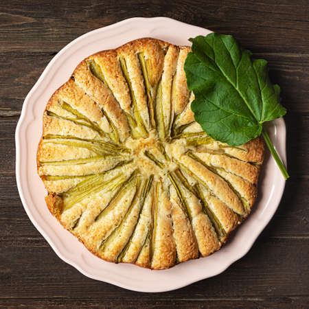 Rhubarb pie, top view on dark wooden backgroundの写真素材
