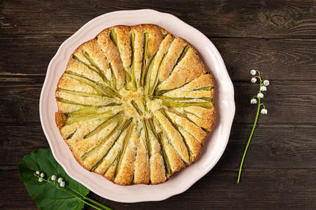 Rhubarb pie, top view on dark wooden backgroundの写真素材