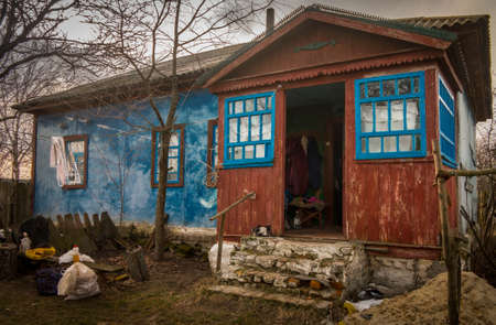 Abandoned village house with cracked paint in Ukraineの写真素材
