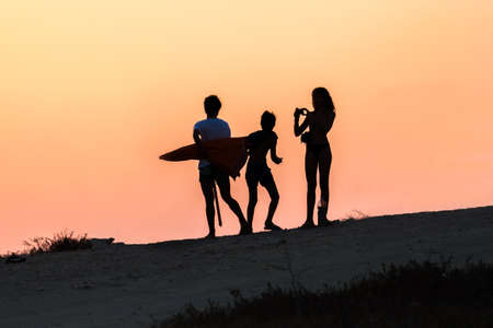 silhouette of children taking picturesの写真素材