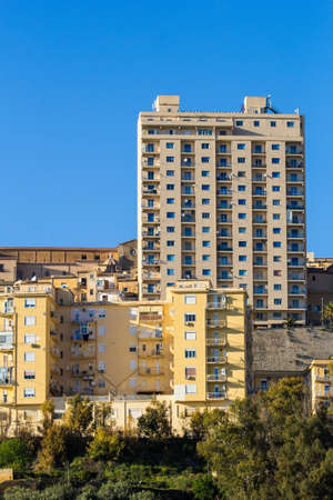 Tolli of Agrigento. Tall buildings symbol of unauthorized constructionの写真素材