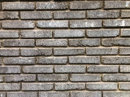 Industrial background, empty grunge urban street with warehouse brick wall