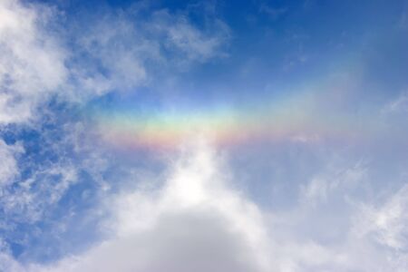 Rainbow above a head in the middle of summerの写真素材