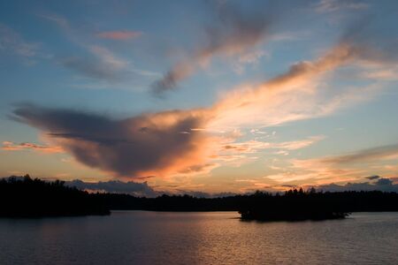 Sunset in the north of the Leningrad area in Julyの写真素材
