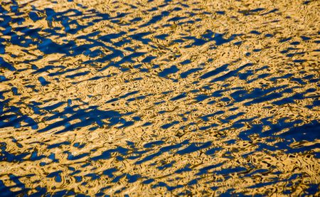 Sunny bright reflection in the riverの写真素材