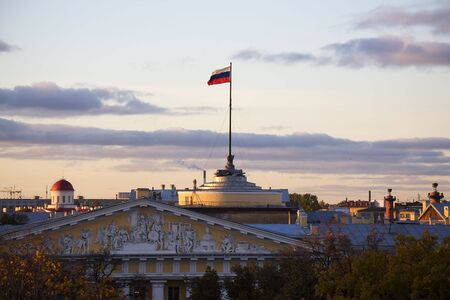 Russian flag on Admiralty's gate above Petersburg's cityscapeの写真素材