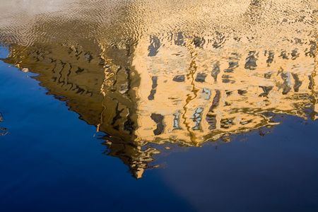 the reflection of Petersburg's residential house in water