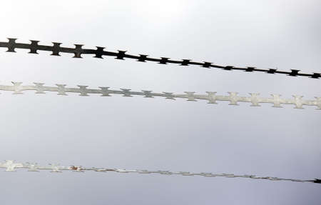 Metal fencing close up on sky backgroundの写真素材