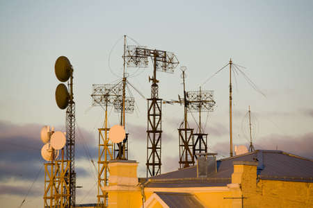 urban view of multitude of antennas on the roofの写真素材