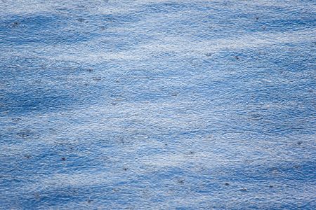 Drops of a rain on a surface of lakeの写真素材