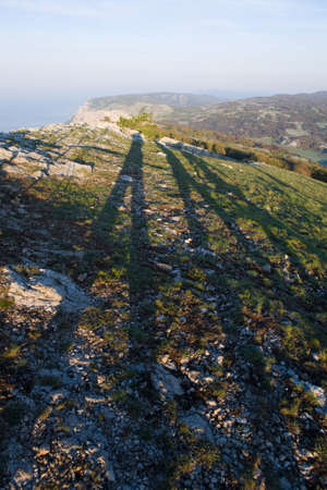 Mountain landscape with long shadows in the morningの写真素材