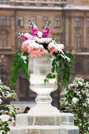 Flowers in an ice vase in city streetの写真素材