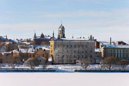 Quay with old houses and Watch Tower in Vyborgの写真素材