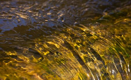 Fast motion of water in the riverの写真素材