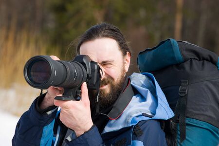The tourist with the big camera during a passage