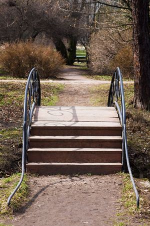 The small wooden bridge in spring parkの写真素材
