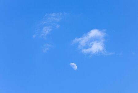 sky landscape - the moon and clouds in sunny dayの写真素材