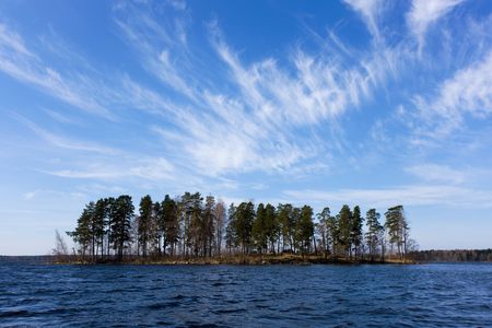 Landscape with small island on lake in springの写真素材