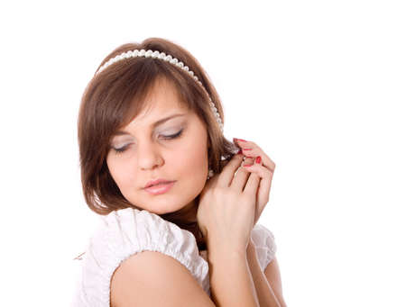 Portrait of the girl with a white beads close upの写真素材