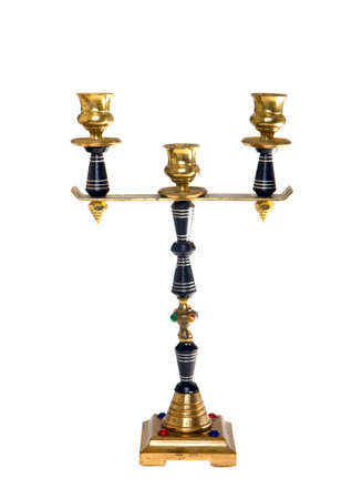 Metal candlestick with ornaments on a white backgroundの写真素材