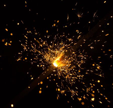 sparking Bengal fires on black background close-upの写真素材