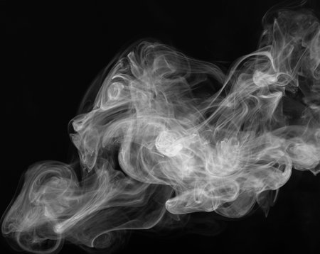 Cigarette smoke close up on a black backgroundの写真素材
