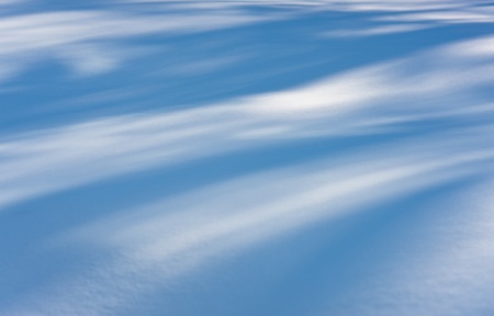 Snow with shades in sunny winter dayの写真素材