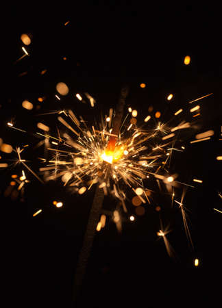 Burning Bengal fire on a black backgroundの写真素材
