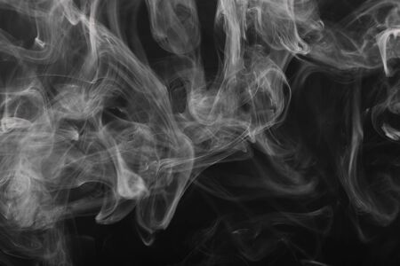 Cigarette smoke close up on a black backgroundの写真素材