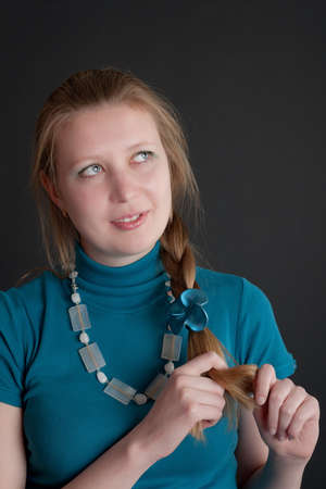 the girl with a fair hair on a black background